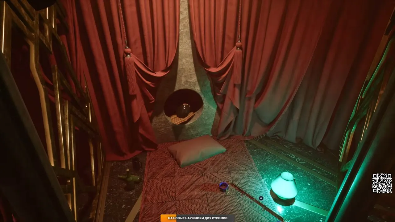 Spreader lying beside a green lamp in a curtained Club room